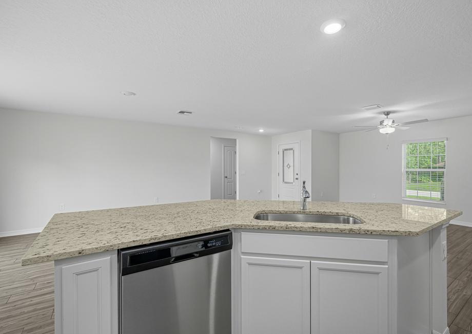 The kitchen has a large island that will be perfect for you and your family to gather around