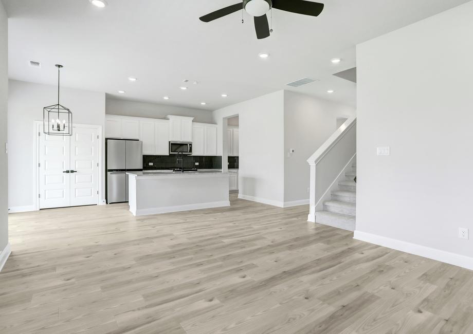 Spacious living area, connected to a breakfast nook and upgraded kitchen.