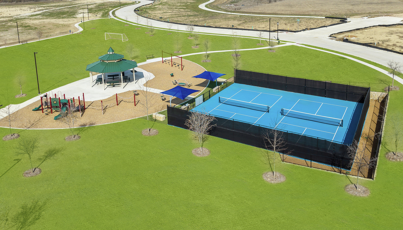 The pickleball courts sit adjacent to the park, gazebo and soccer field.
