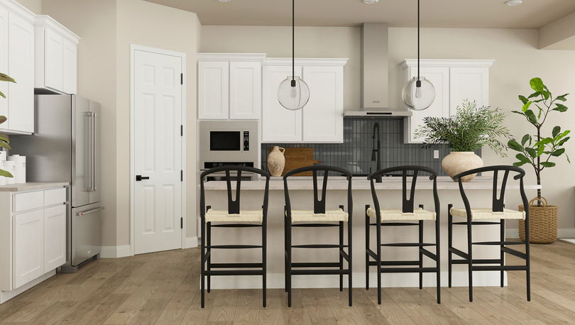 Rendering of the spacious kitchen in the
  Orchid, complete with a large island, tiled backsplash, white cabinets and
  stainless steel appliances.