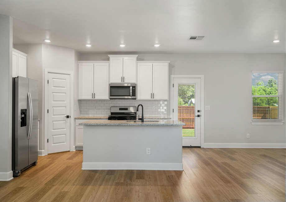 The beautiful kitchen has a wonderful kitchen island.