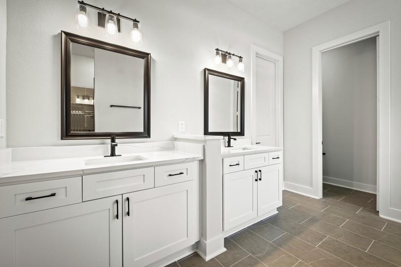 The master bathroom has a dual-sink vanity.