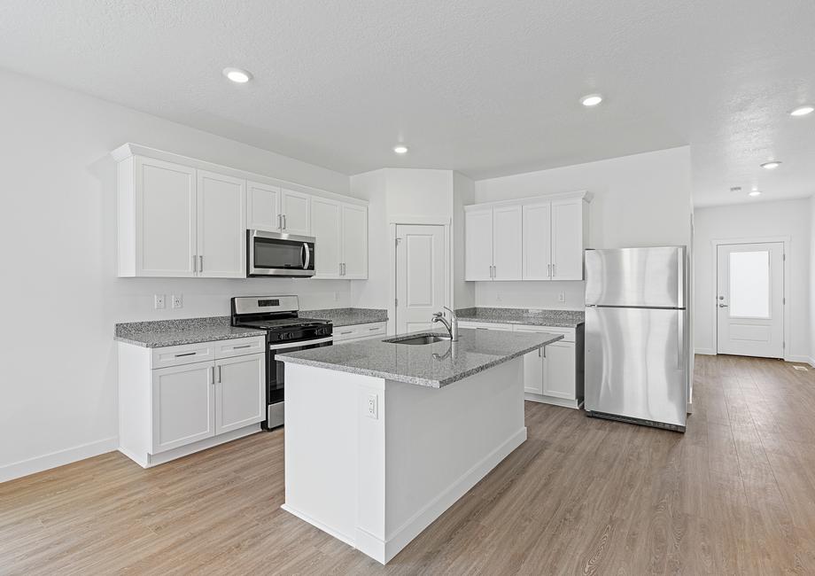 The spacious kitchen comes fully equipped with stainless steel appliances