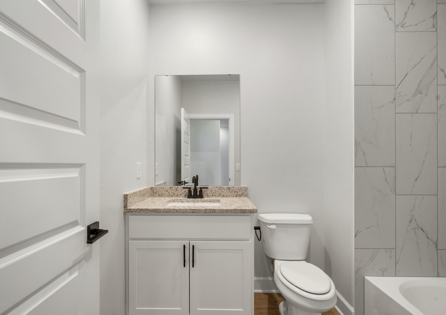 The secondary bathrooom has a convenient vanity space.