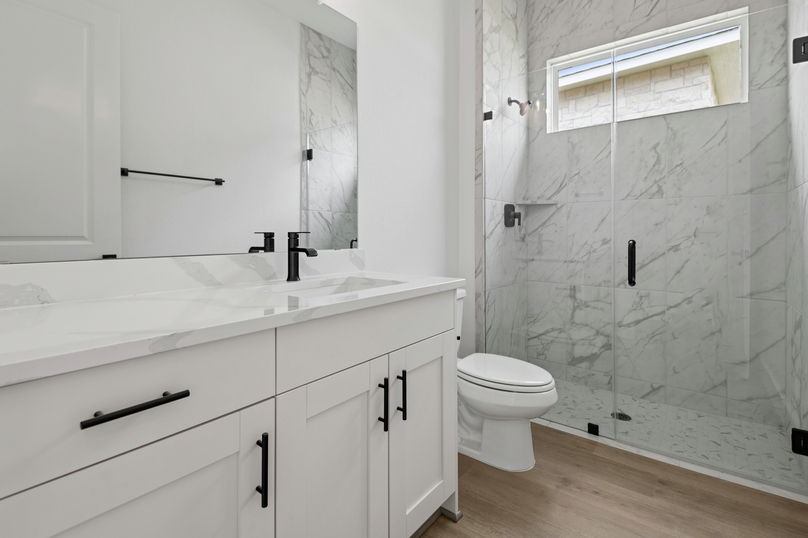 The secondary bath has a walk-in shower.