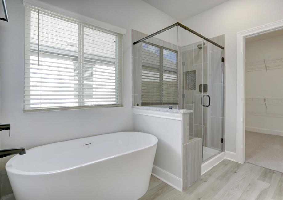 Master bath with a soaking tub and walk-in shower.