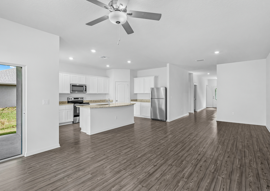 The foyer welcomes guest into the family room and adjoining kitchen