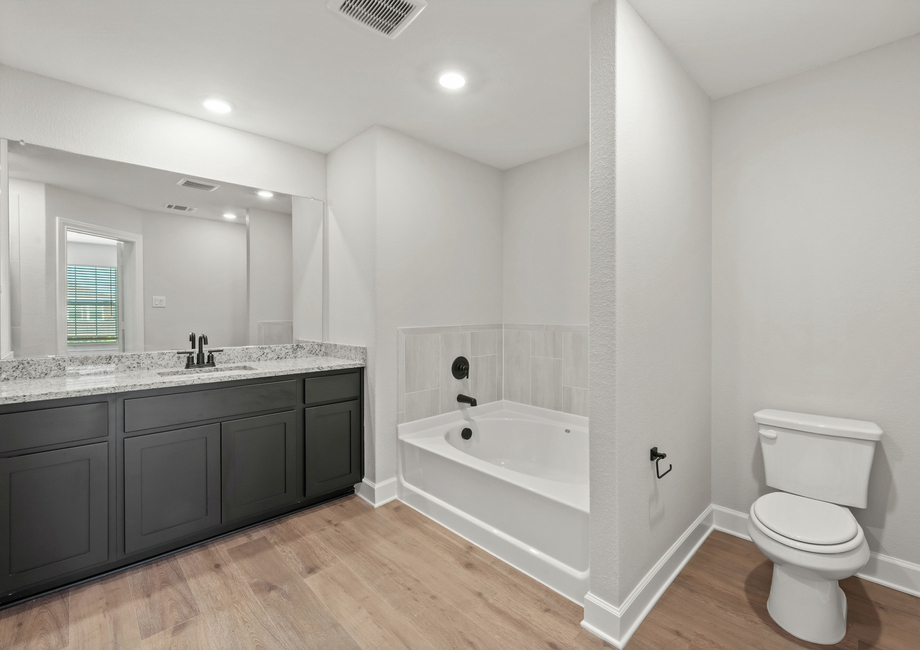 The master bathroom has a large garden tub.