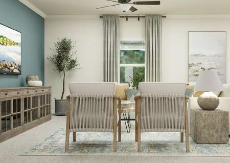 Rendering of the living room looking
  towards the backyard through a window. The room is furnished with a
  sectional, two accent chairs and a media cabinet.