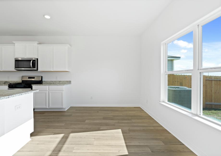 The dining room with a big window.