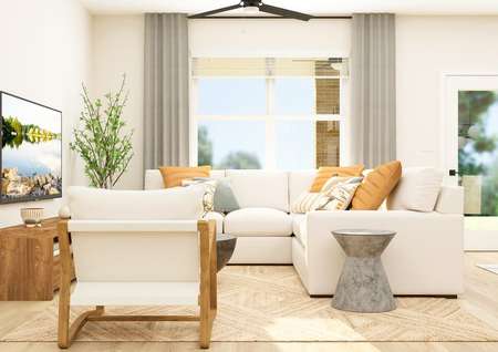 Rendering of the open layout family room
  featuring modern furniture and large windows that let in natural light.