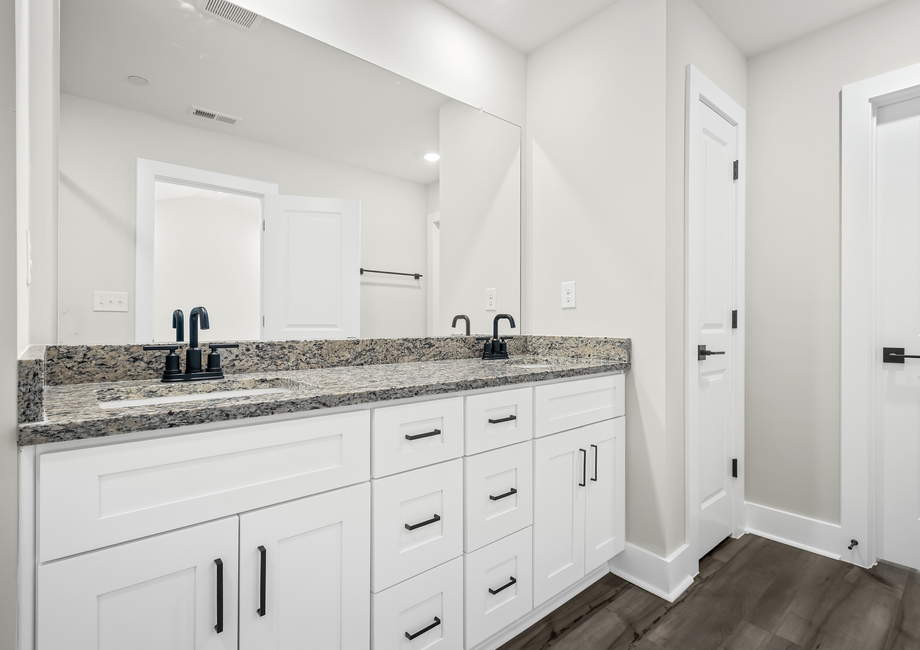 The primary bathroom includes a double sink vanity