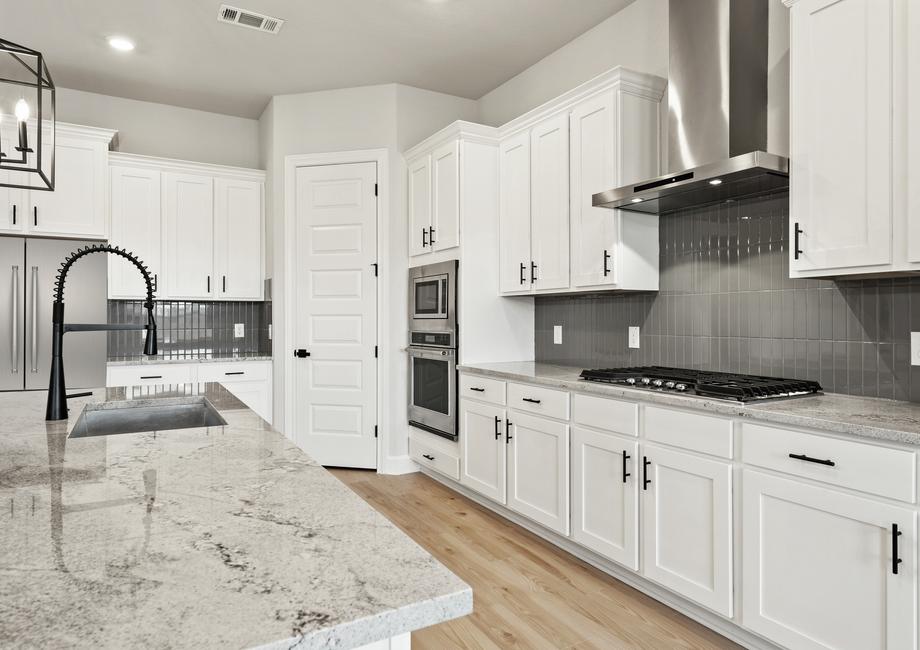 The fully loaded kitchen comes with stainless steel appliances.