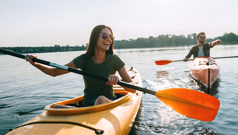 Young couple in a canoe on a beautiful lake.