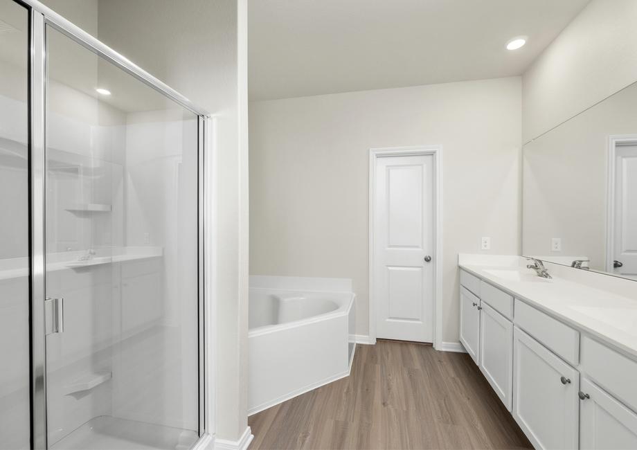 The master bath has a large soaker tub and separate shower.