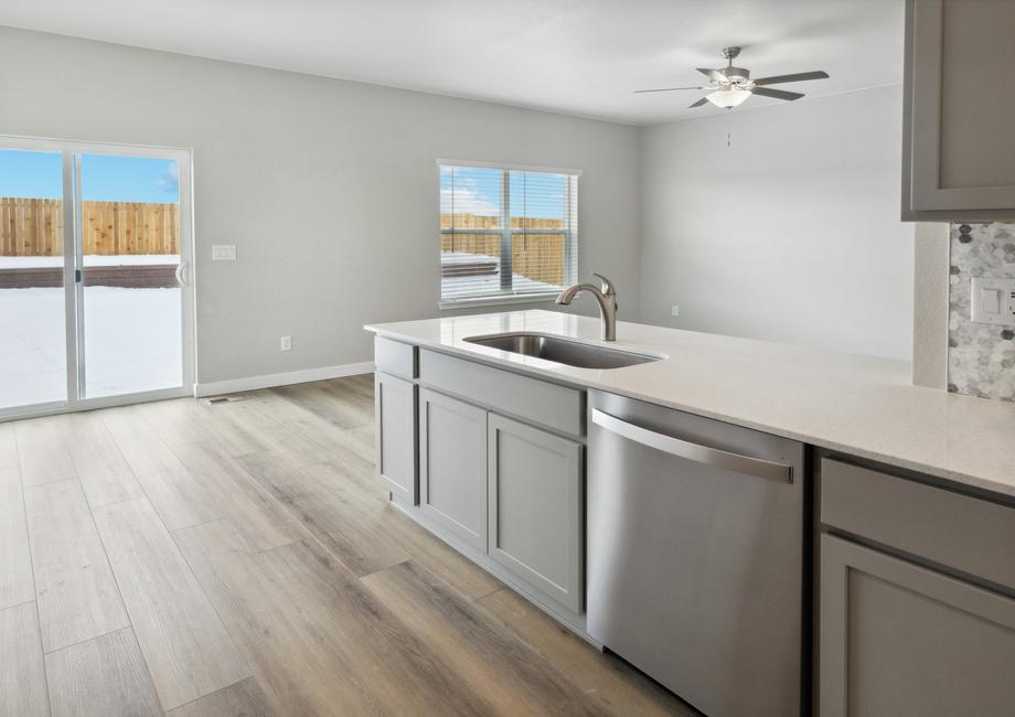 The large windows in the Chatfield allow for great natural lighting in the kitchen, dining room and family room.