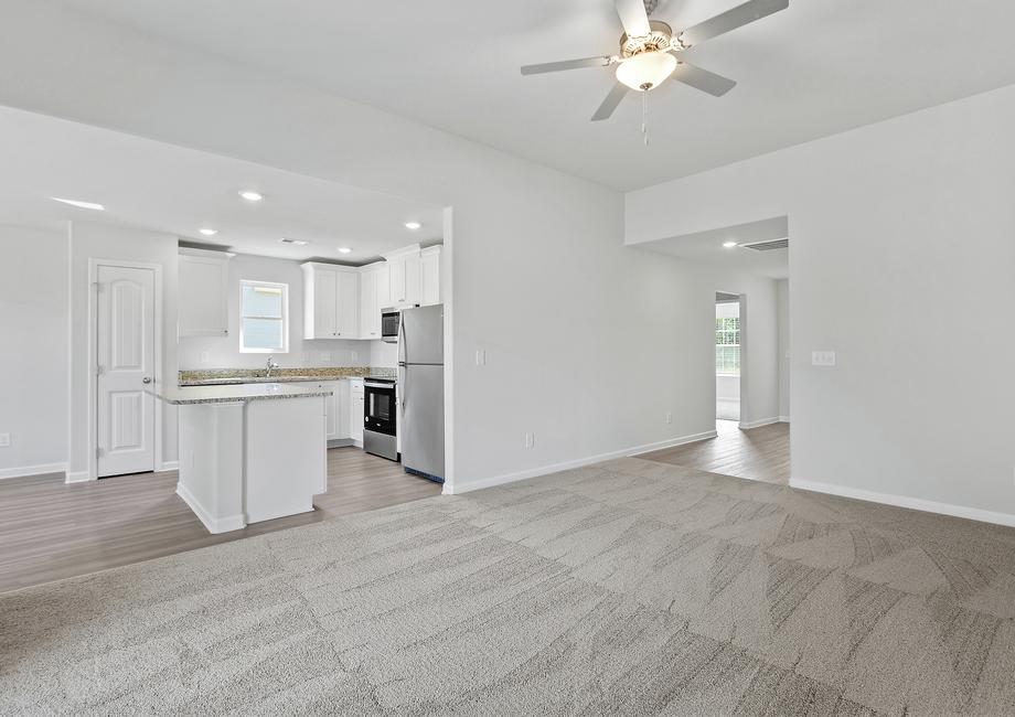 Open layout with views of the living room and the kitchen.