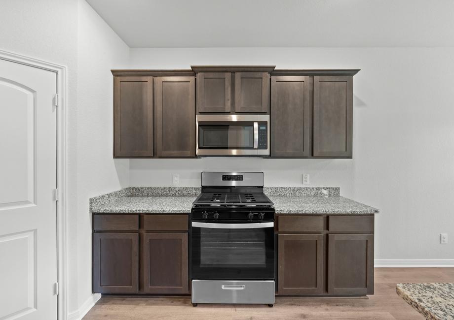 The kitchen of the Juniper has gorgeous wood cabinetry.