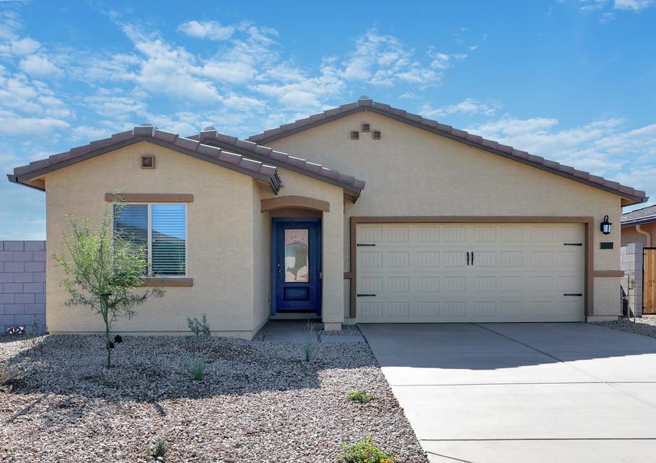 This home has a beautiful stucco exterior and features a blue door.