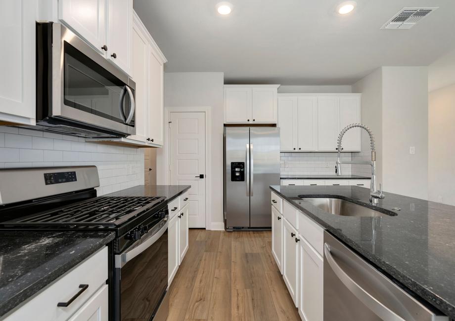 The kitchen is truly the heart of the home and is sure to impress guests.