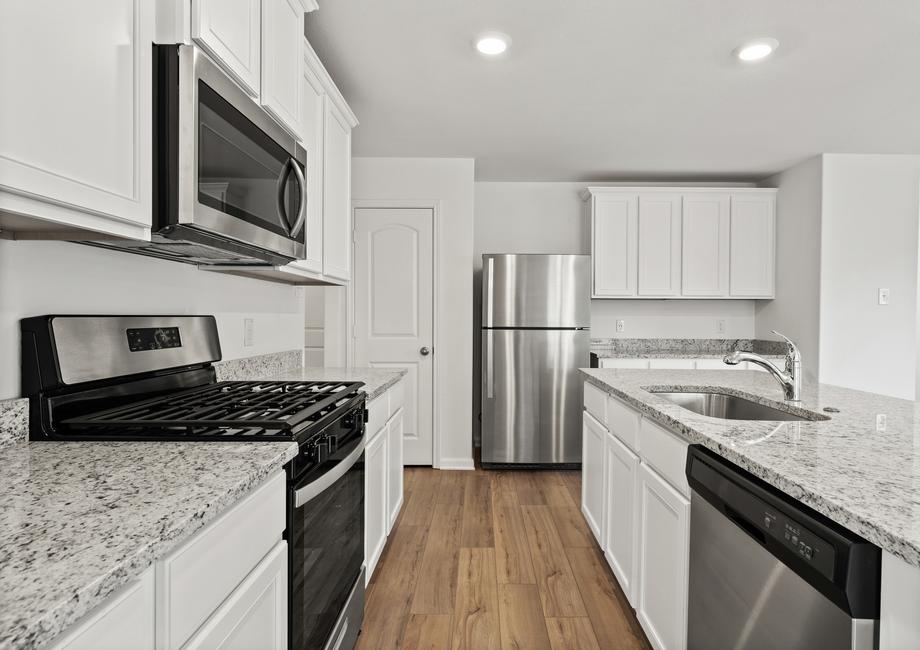 The chef ready kitchen with stainless steel appliances