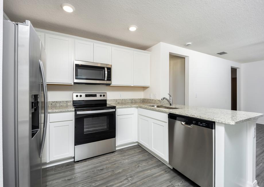 Stainless steel appliances come included in the kitchen