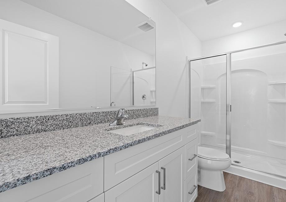 The master bathroom offers plenty of space to get ready in the mornings