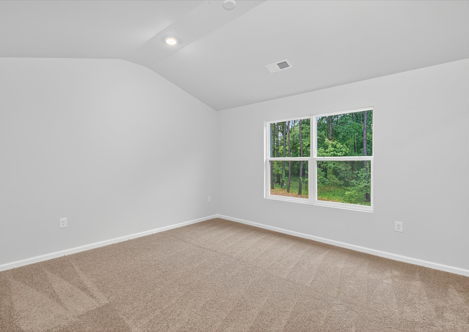 Tall ceilings and large windows in the master bedroom. 