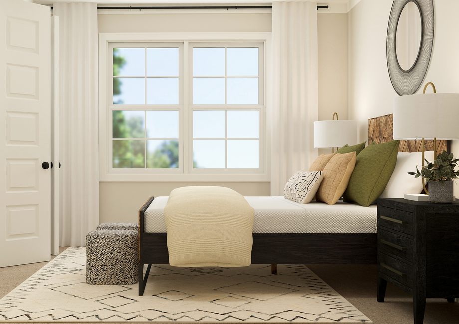 Rendering of a bedroom highlighting a
  large winter with white curtains. This room is also furnished with a large
  bed and side tables.