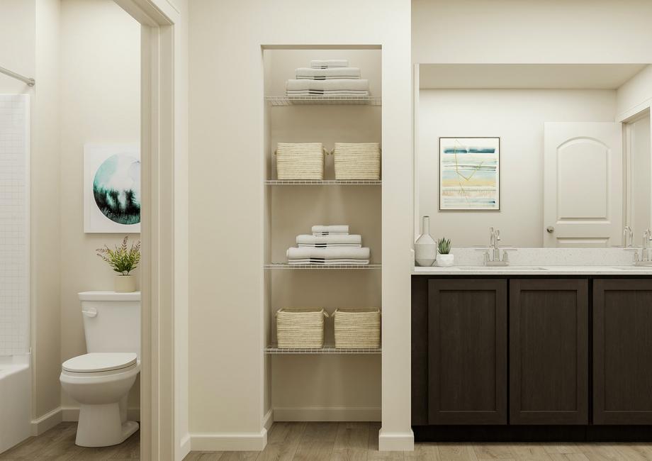 Rendering of the secondary bathroom
  featuring a large vanity, storage, and tiled bathtub.